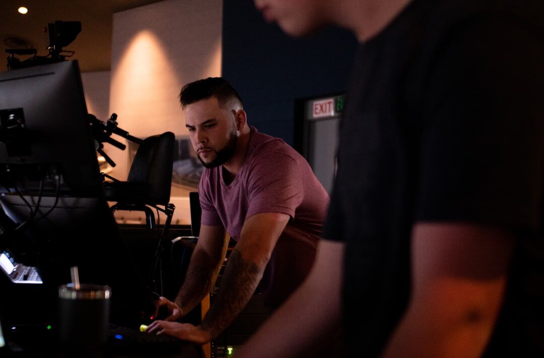 Camera operator filming live broadcast in studio