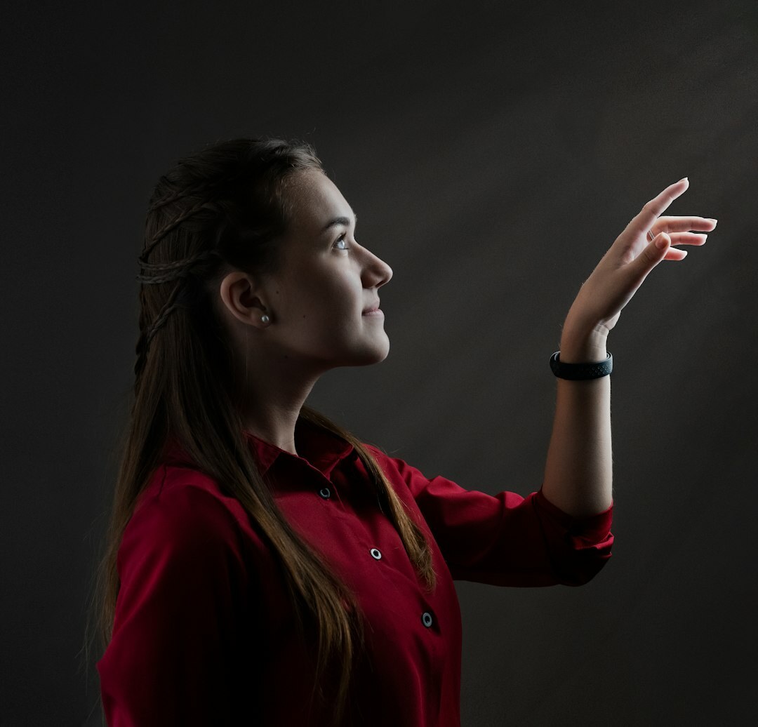 Professional woman with dark hair, camera operator instructor