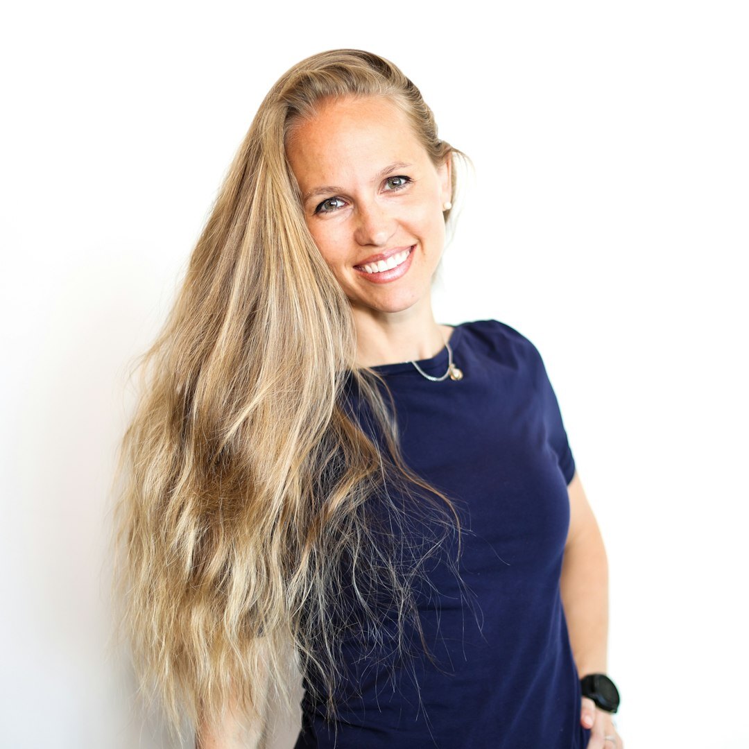 Professional woman with blonde hair, broadcast producer